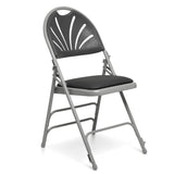 Metal folding chair with black vinyl seat pad and black plastic fan shaped back.