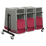 Red plastic folding chairs hanging on steel chair trolley for storage.