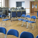 Folding chair trolleys and folding chairs in community centre hall.