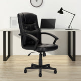 High back bonded leather black office chair in modern home office setting.