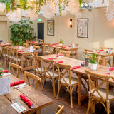 Crossback Stacking Chairs and Rustic Farmhouse Tables in Cafe.