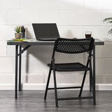 Aran Black Contemporary Plastic Folding Chair in Home Office Setting.