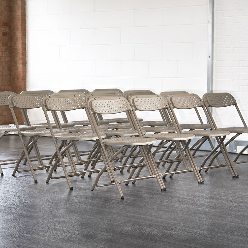 Grey BigClassic Plastic Folding Chairs in Rows.