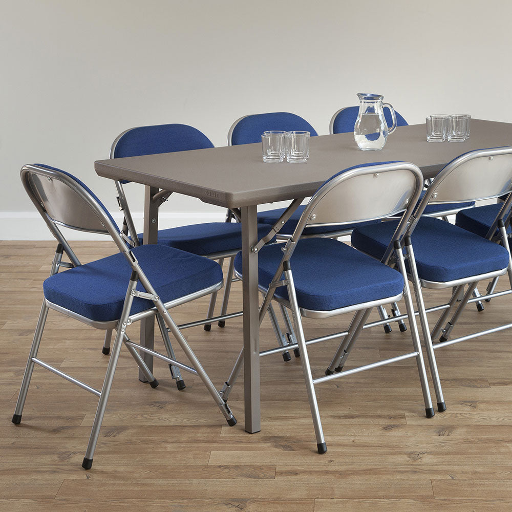 Blue Comfort Deluxe folding chairs around a grey folding meeting table.