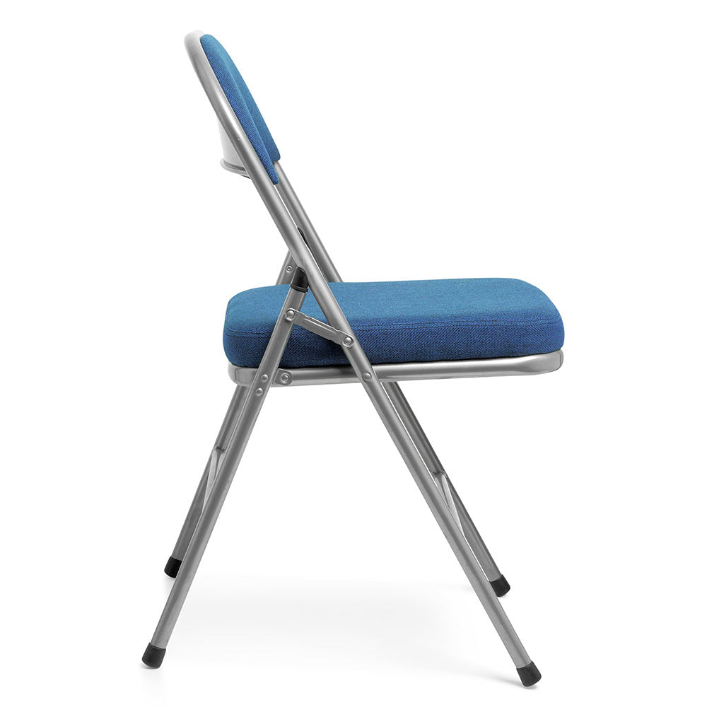 Comfort Deluxe padded folding chair with blue upholstery and silver frame, side profile view.