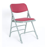 Red padded folding chair with light grey frame.