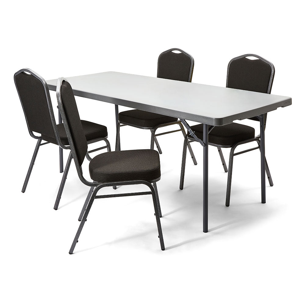 Four black banqueting chairs arrange around a grey folding table.