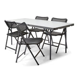 Aran Plastic Folding Chairs set around a foldng table - ideal for home use or meeting spaces